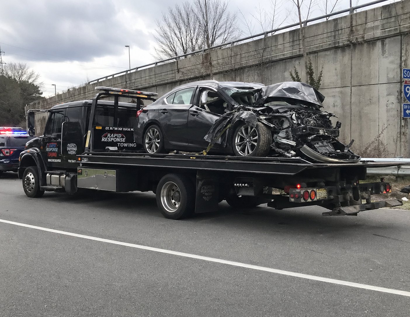 Rapid Response Towing flatbed on the highway